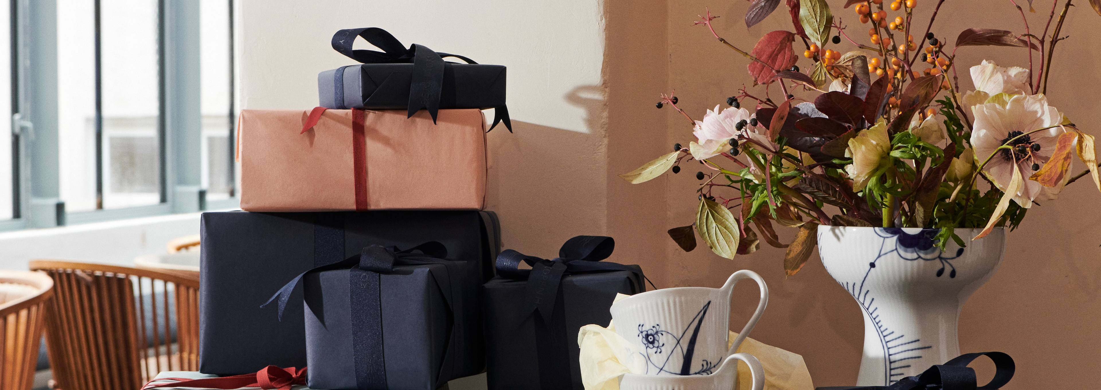 A table filled with Royal Copenhagen gift wrapped porcelain for the graduate